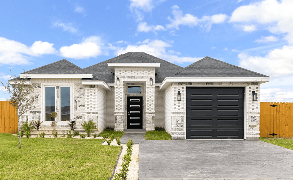 Modern single-family home with a sleek design and lush landscaping.
